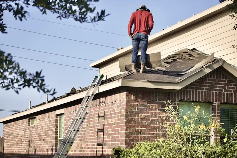 Professional roofer working on a residential roof in Cypress Estates